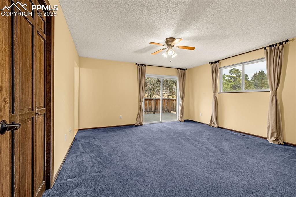 Image 16 of 50: Private Trex deck off primary