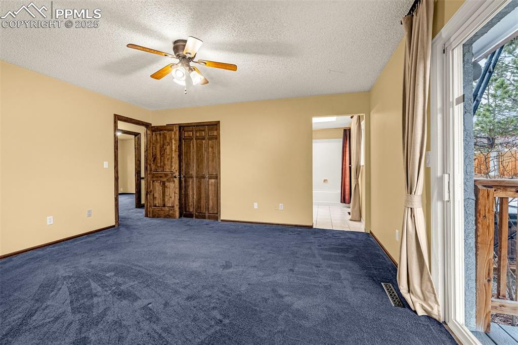 Image 17 of 50: Upper level primary bedroom