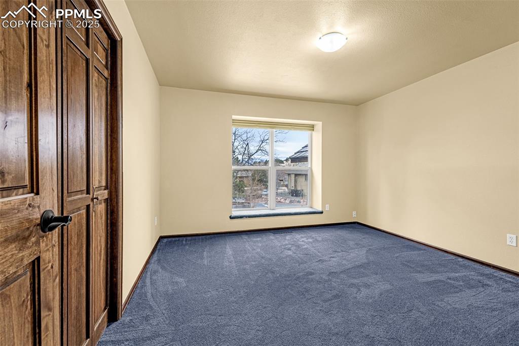 Image 19 of 50: Upper level bedroom