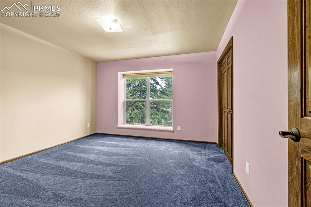 Image 20 of 50: Upper level secondary bedroom