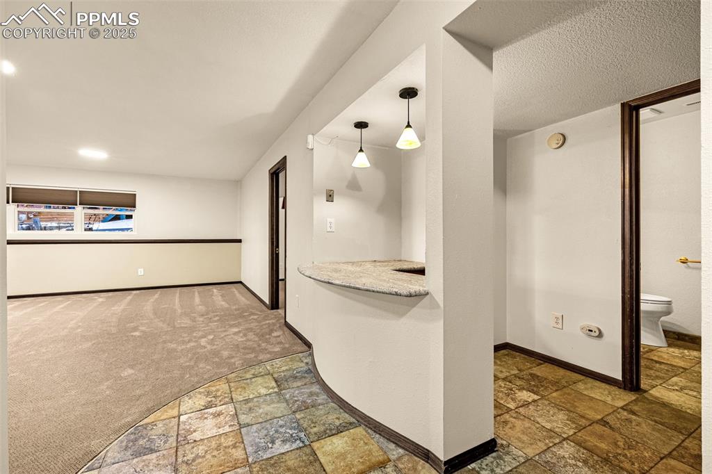 Image 22 of 50: lower level office/work station