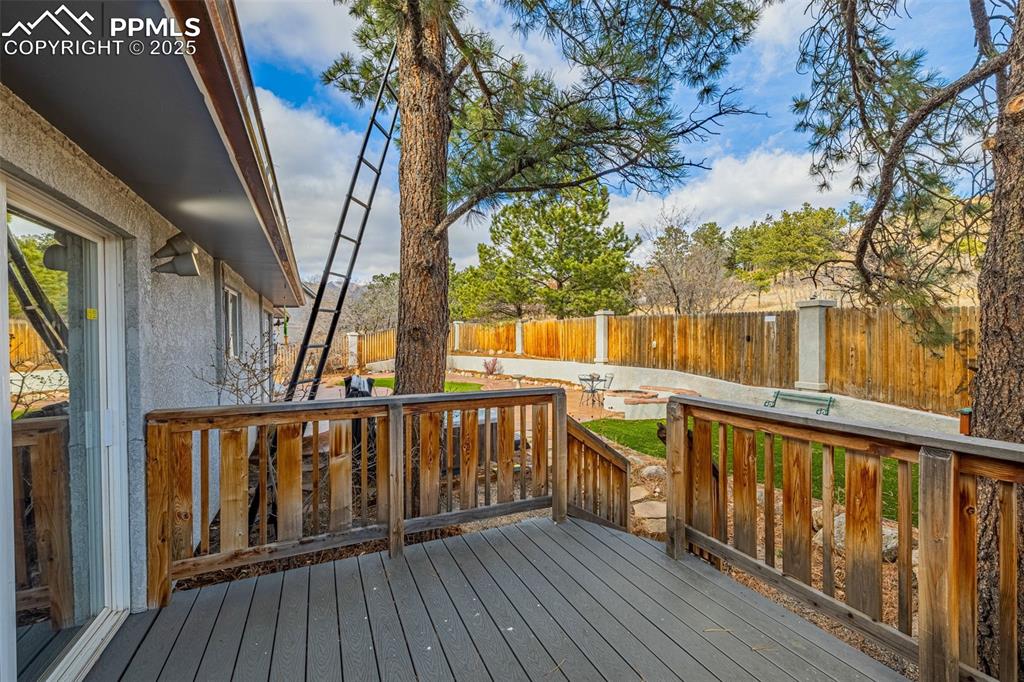 Image 32 of 50: Trex Deck featuring a fenced backyard