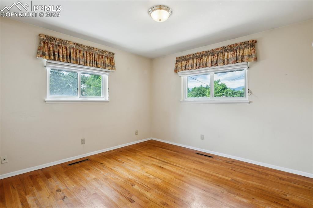 Image 20 of 30: Unfurnished room featuring light wood-type flooring