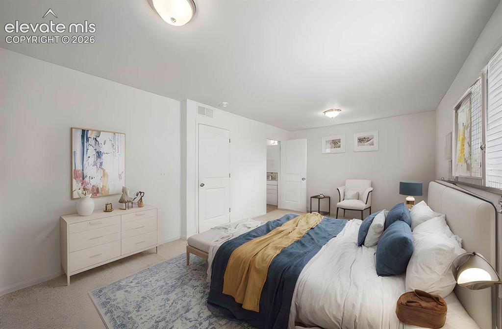 Image 6 of 18: Carpeted room featuring a window with white louvered blinds, two interior d