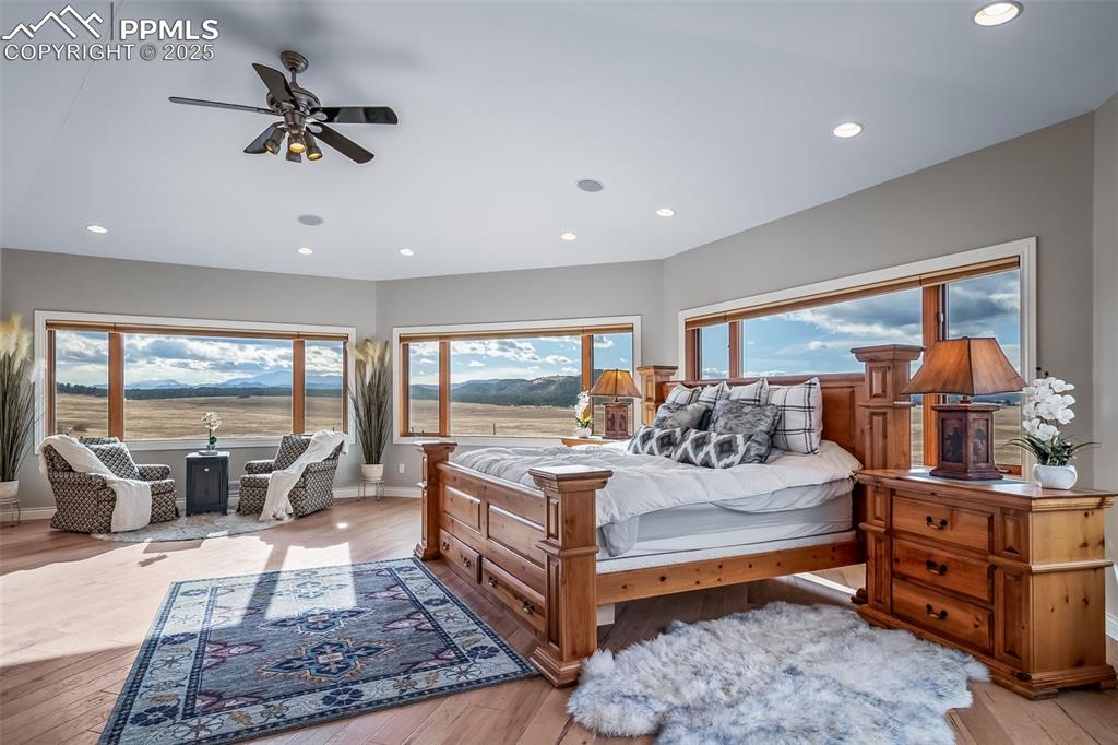 Image 22 of 50: Bedroom featuring light wood-type flooring, recessed lighting, and ceiling 