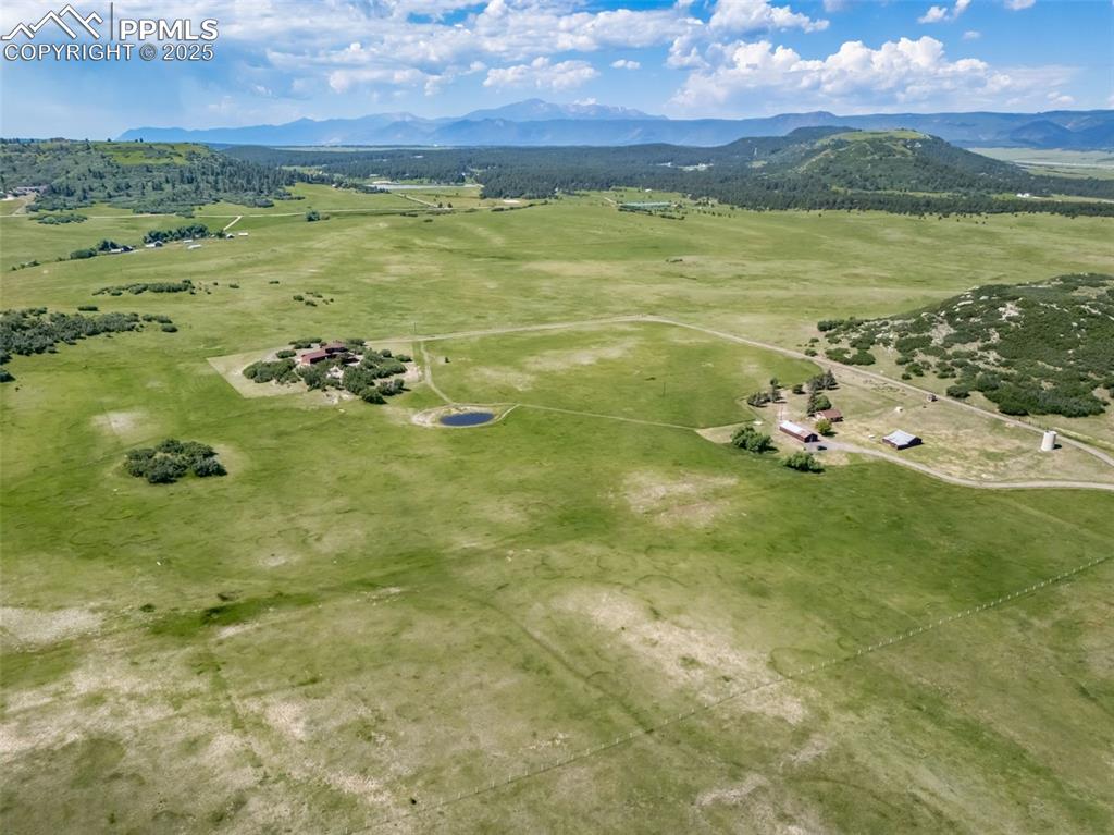 Image 49 of 50: Overview of rural landscape featuring mountains