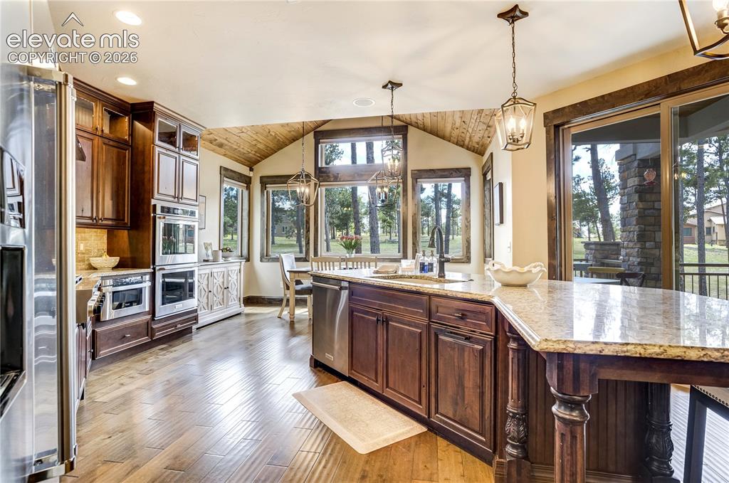 Image 19 of 50: A well-appointed mud room off of the four car garage flows effortlessly int