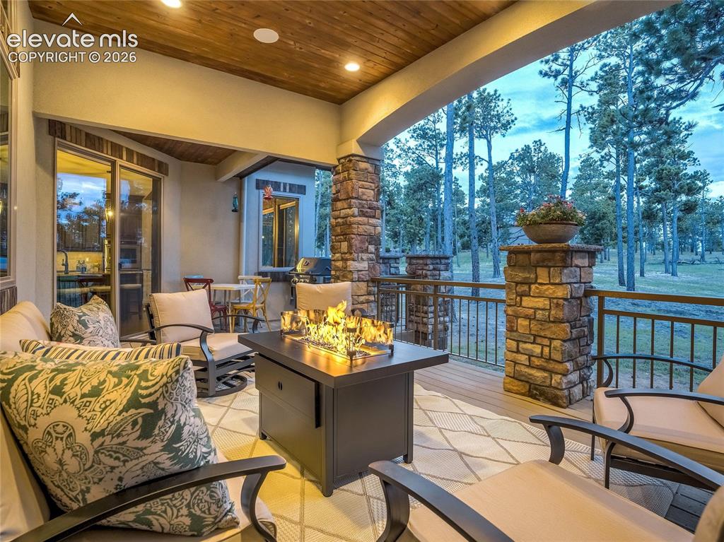 Image 7 of 50: Framed by rustic windows and towering beams with architectural detail, the 