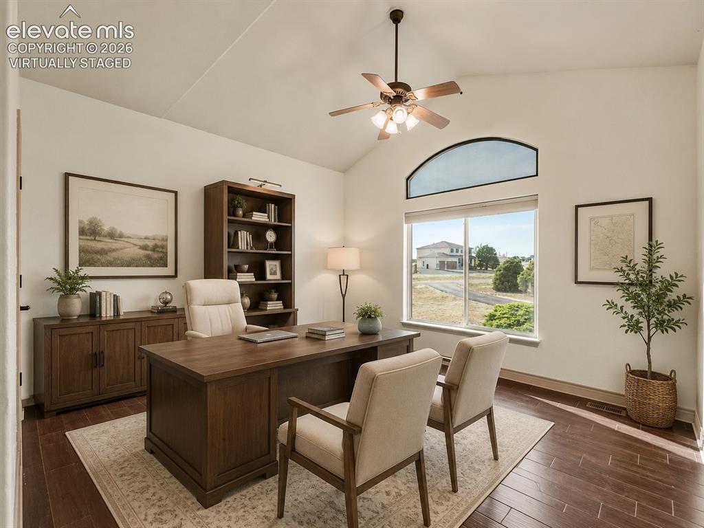 Image 29 of 49: Virtually Staged: Vaulted ceiling with a ceiling fan, arched transom window