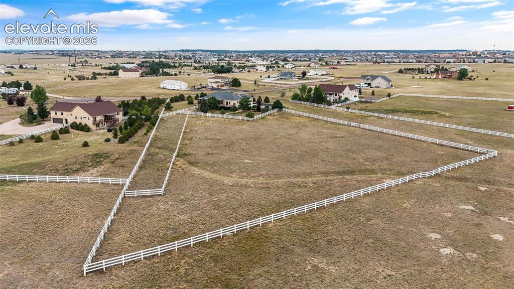 Image 46 of 49: Expansive equestrian property featuring substantial acreage with profession