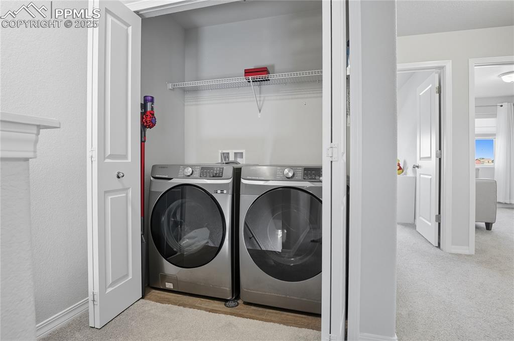 Image 18 of 31: LAUNDRY AREA (WASHER AND DRYER INCLUDED) WITH HOOKS AND SHELVES FOR PROPER