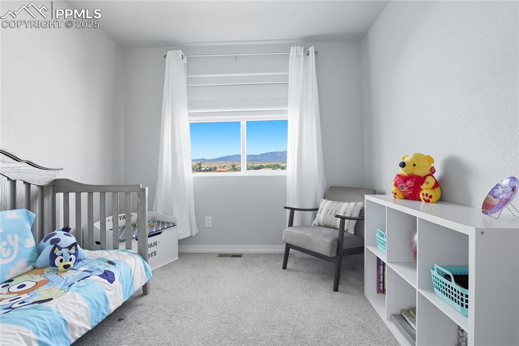 Image 19 of 31: BEDROOM WITH MOUNTAIN VIEWS