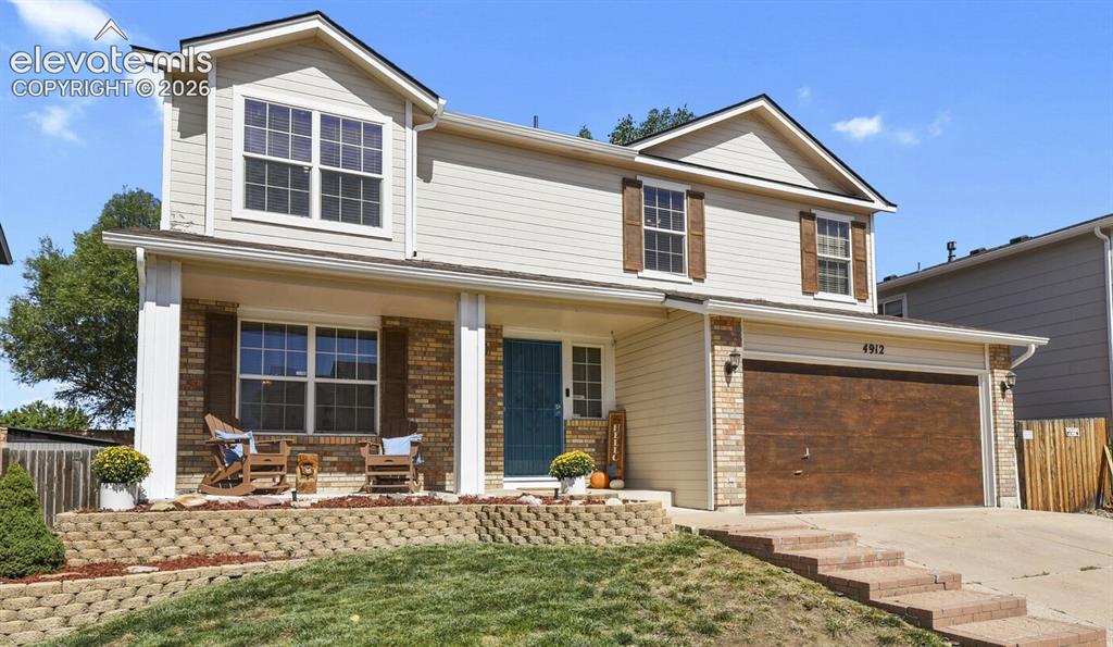 Caption: Front of House from left corner of the yard.