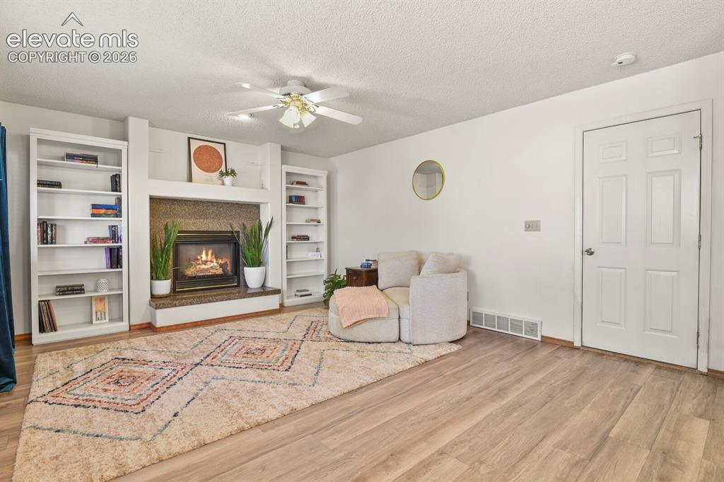 Image 11 of 44: Family room looking towards door to the garage.