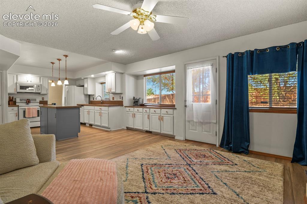 Image 13 of 44: Far corner of Family Room looking towards kitchen.