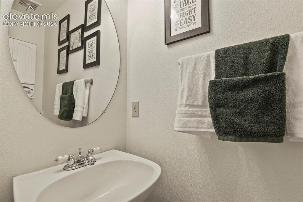 Image 18 of 44: Half bath on the main level.