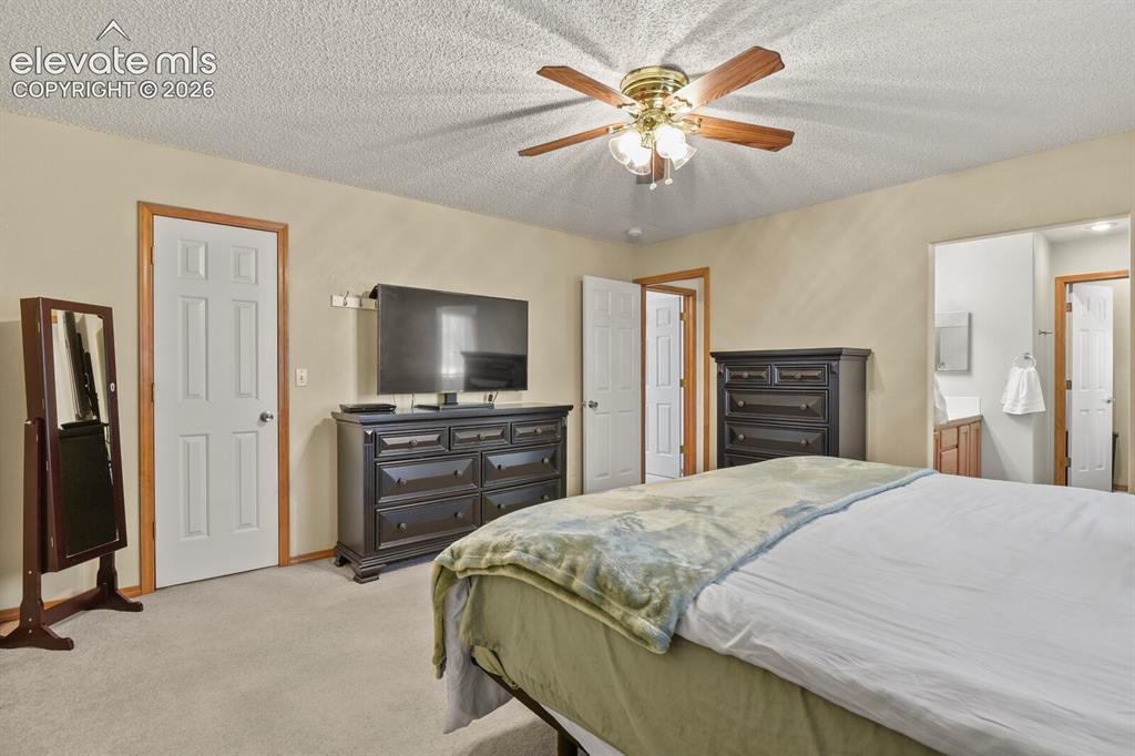 Image 20 of 44: Primary Bedroom looking toward entrance and en suite bathroom.