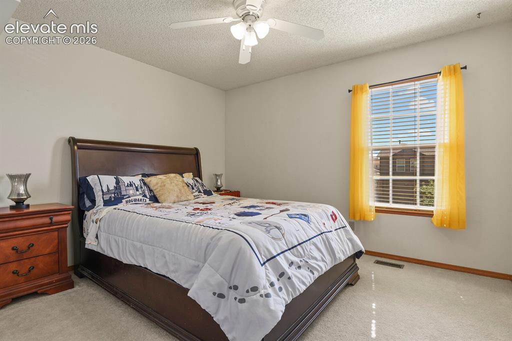 Image 23 of 44: Secondary upstairs bedroom.