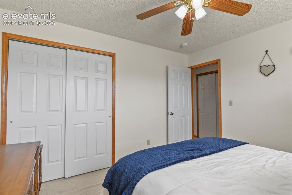 Image 26 of 44: Corner of 2nd upstairs bedroom looking towards the entrance.