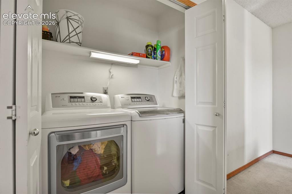 Image 29 of 44: Laundry area, upstairs hallway.