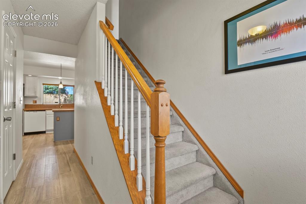 Image 5 of 44: Entrance looking towards stairway to upper level.