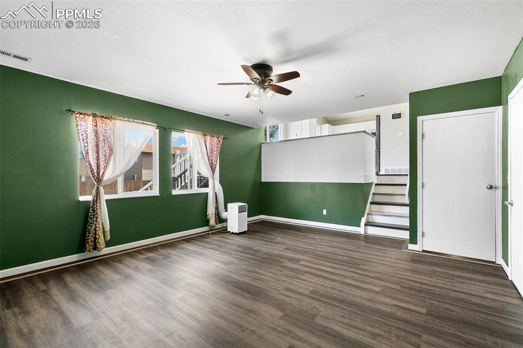 Image 14 of 26: facing upstairs to the kitchen/dining room