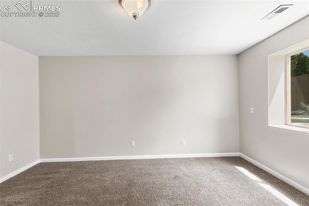 Image 22 of 26: Basement bedroom