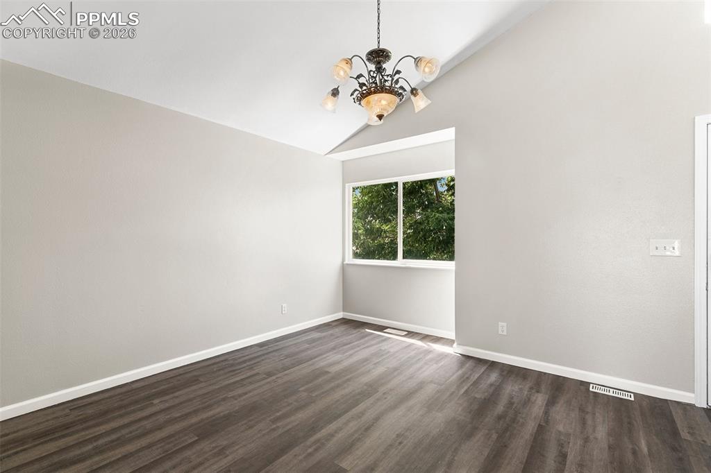 Image 5 of 26: From the kitchen facing the living room with front door on the right