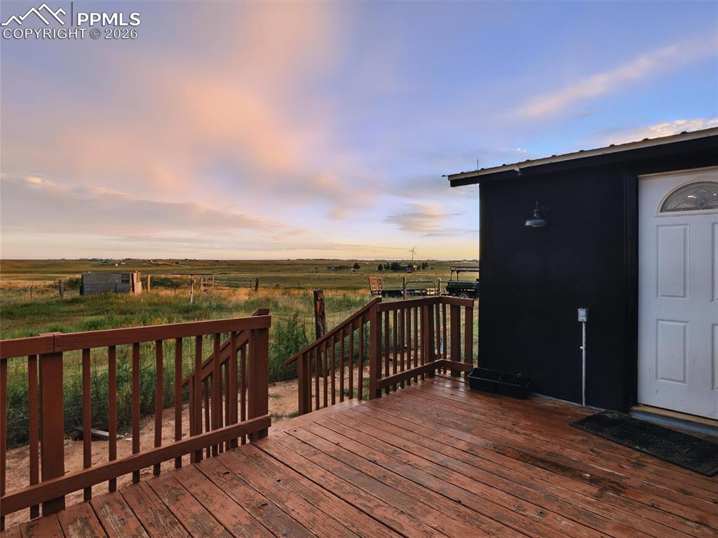 Image 15 of 47: Wooden deck featuring a view of countryside