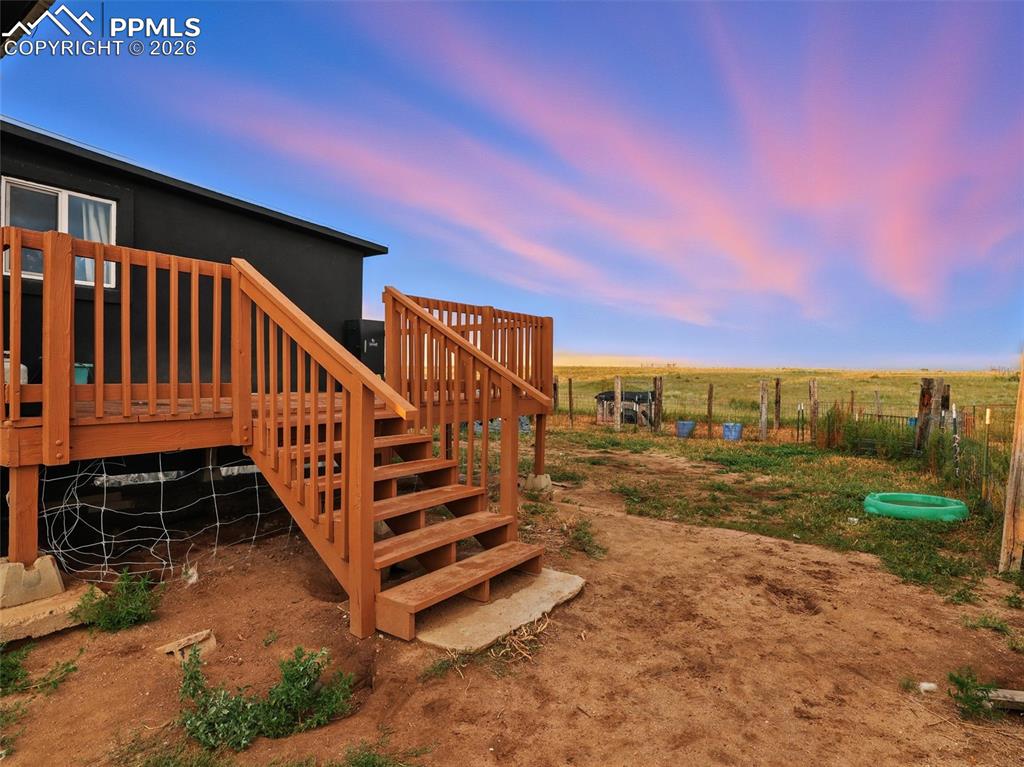 Image 17 of 47: View of yard featuring a deck and a view of rural / pastoral area