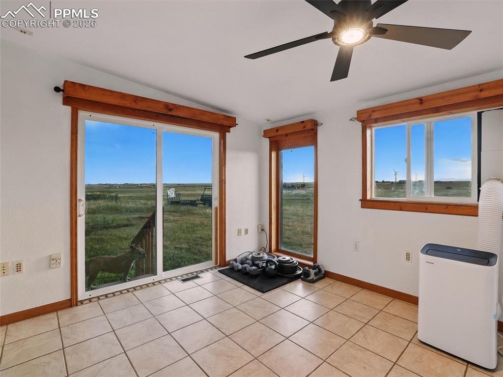 Image 19 of 47: Unfurnished room featuring ceiling fan, healthy amount of natural light, an