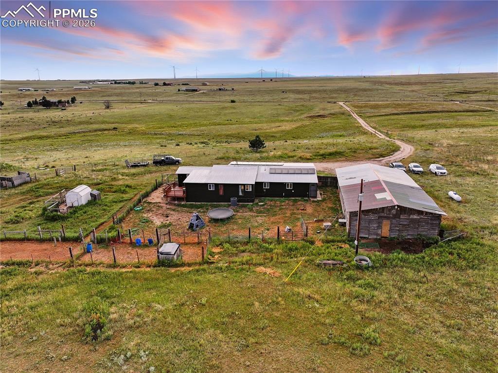 Image 44 of 47: Aerial view at dusk of a rural view