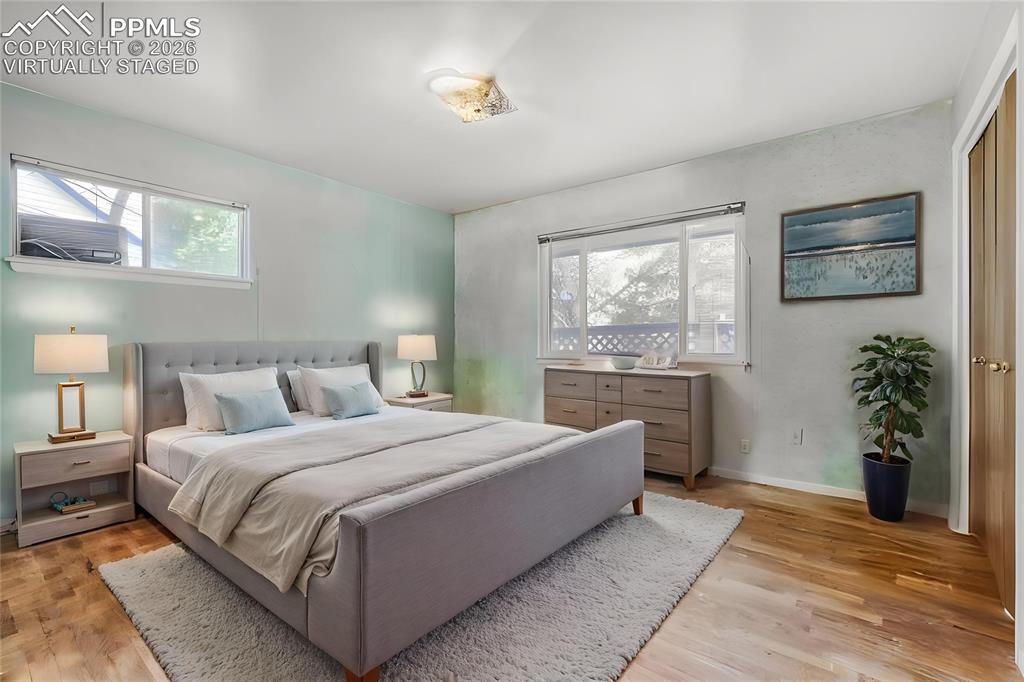 Image 11 of 29: Virtually Staged 
Open-concept living area featuring vaulted ceilings with