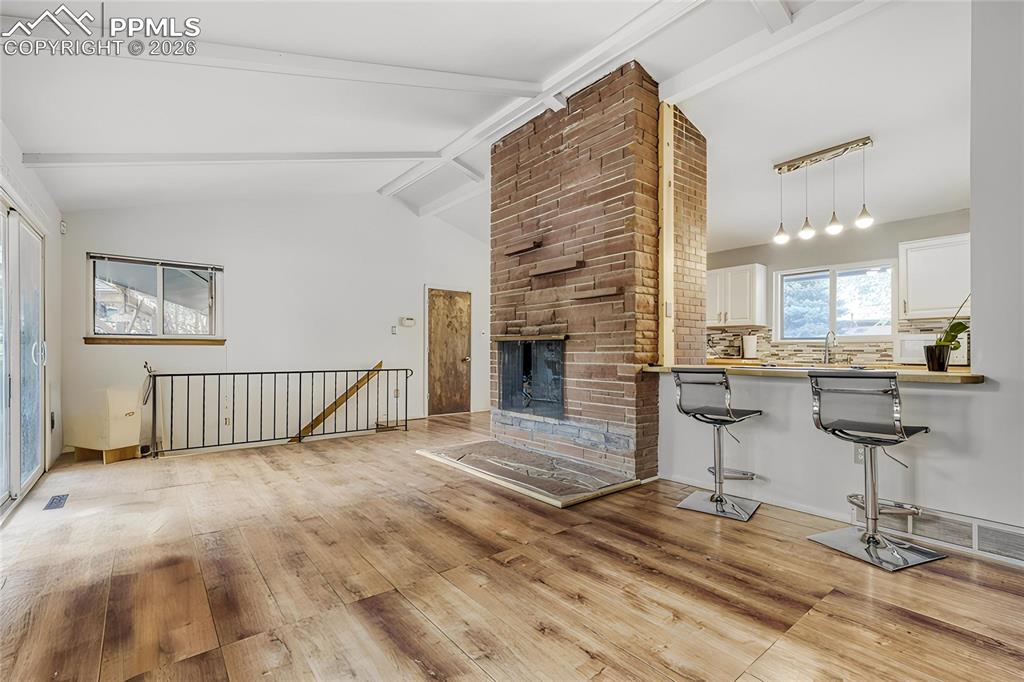 Image 6 of 29: Entryway featuring a wood-panel door with an oval stained-glass insert and 