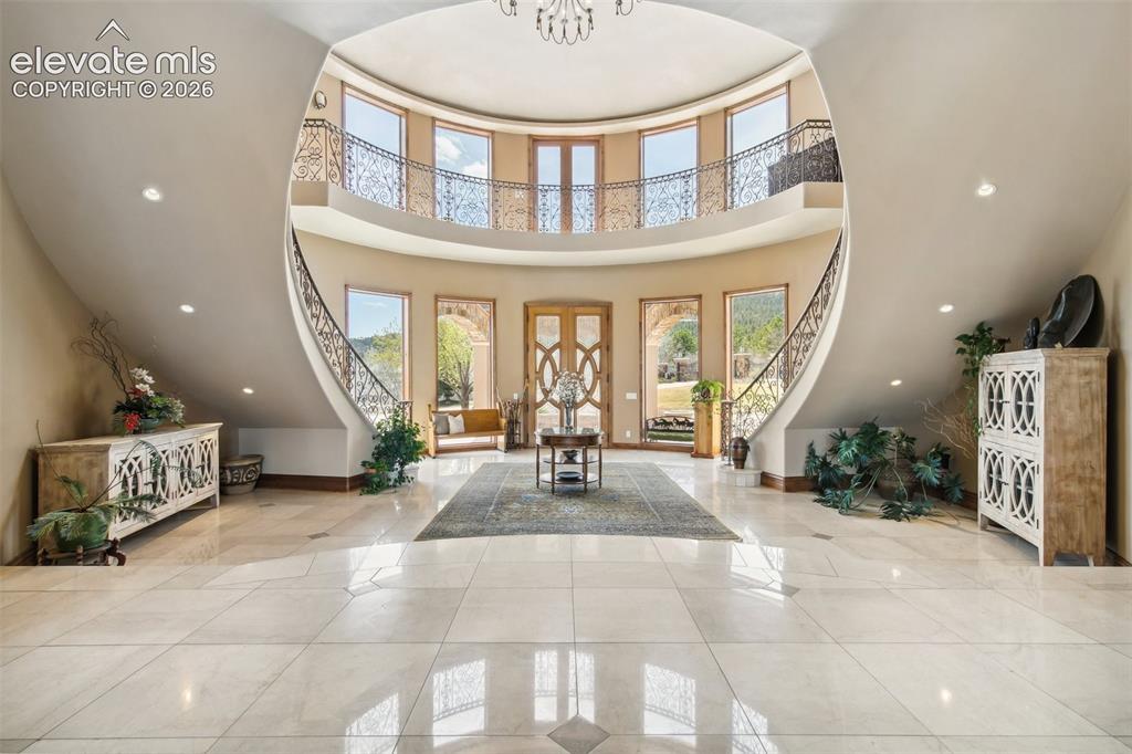 Image 6 of 50: Rotunda-style foyer with suspended arch ceiling