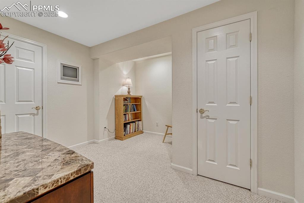 Image 42 of 50: Corridor featuring carpet floors and recessed lighting
