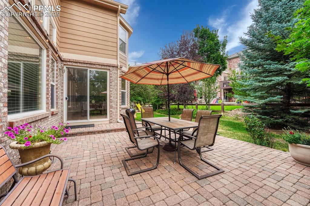 Image 46 of 50: View of patio featuring outdoor dining space