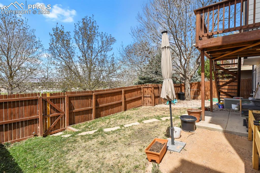 Image 29 of 30: Lower patio and upper deck