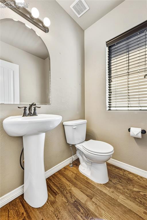 Image 3 of 35: Powder room conveniently located off entry