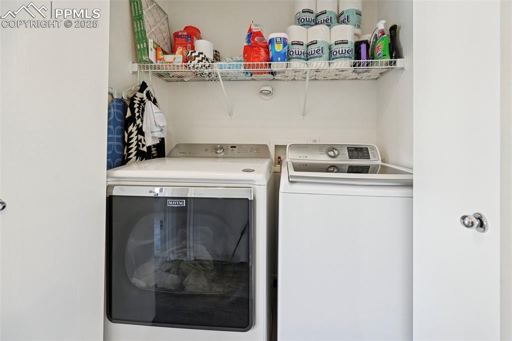 Image 22 of 24: Laundry area featuring independent washer and dryer