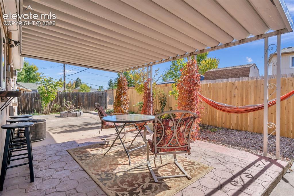 Image 14 of 17: Back Covered Patio