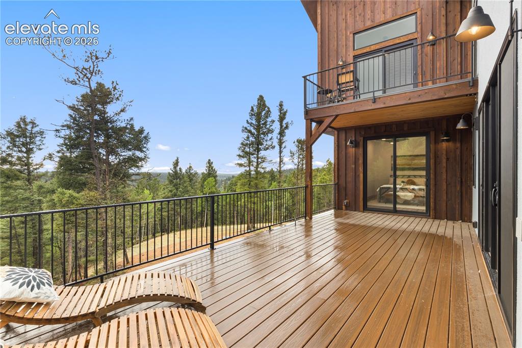 Image 11 of 46: expansive rear deck with gas line for grill and electrical for hot tub