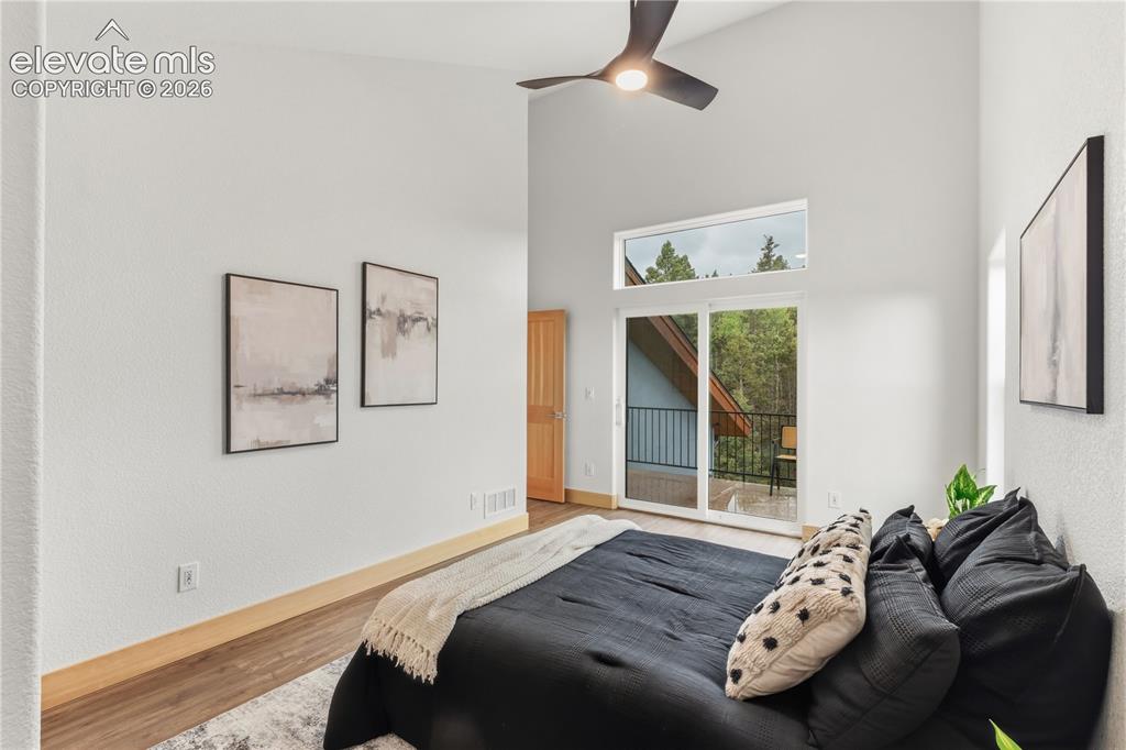Image 32 of 46: 2nd story bedroom with deck access