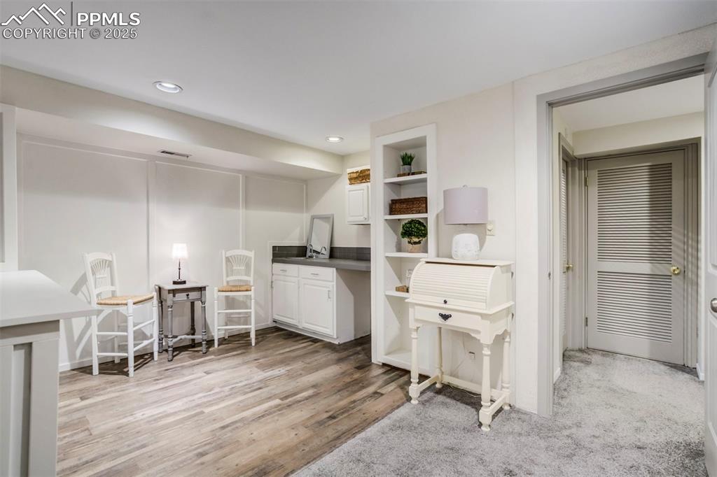 Image 24 of 31: Office featuring light wood-type flooring and recessed lighting