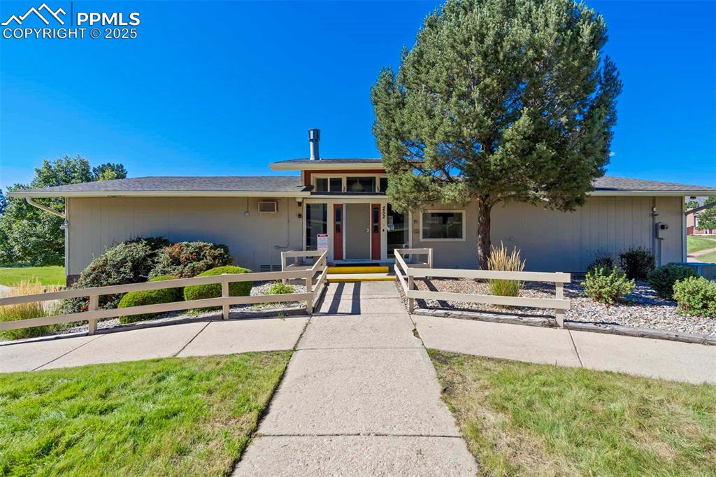 Image 28 of 31: View of front of property featuring a porch and a fenced front yard