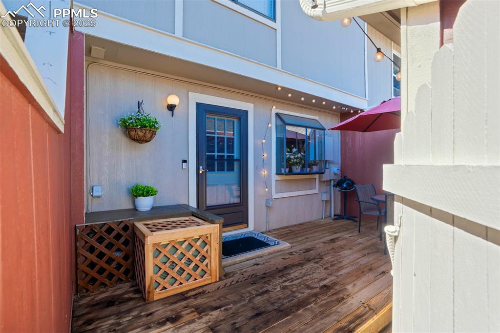 Image 4 of 31: Property entrance with a wooden deck