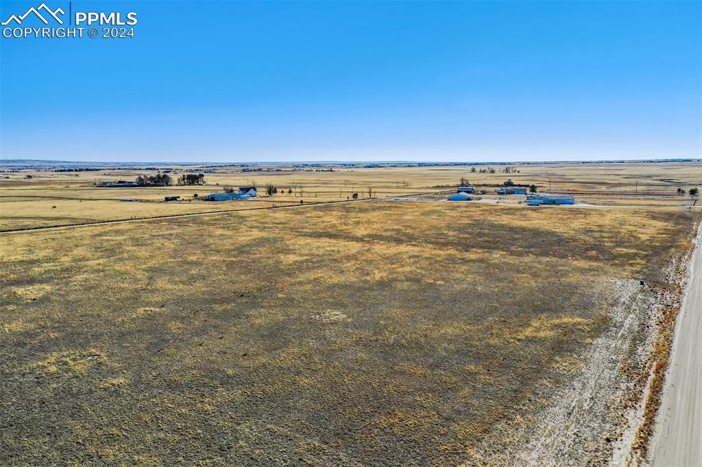 Image 15 of 34: Birds eye view of property with a rural view