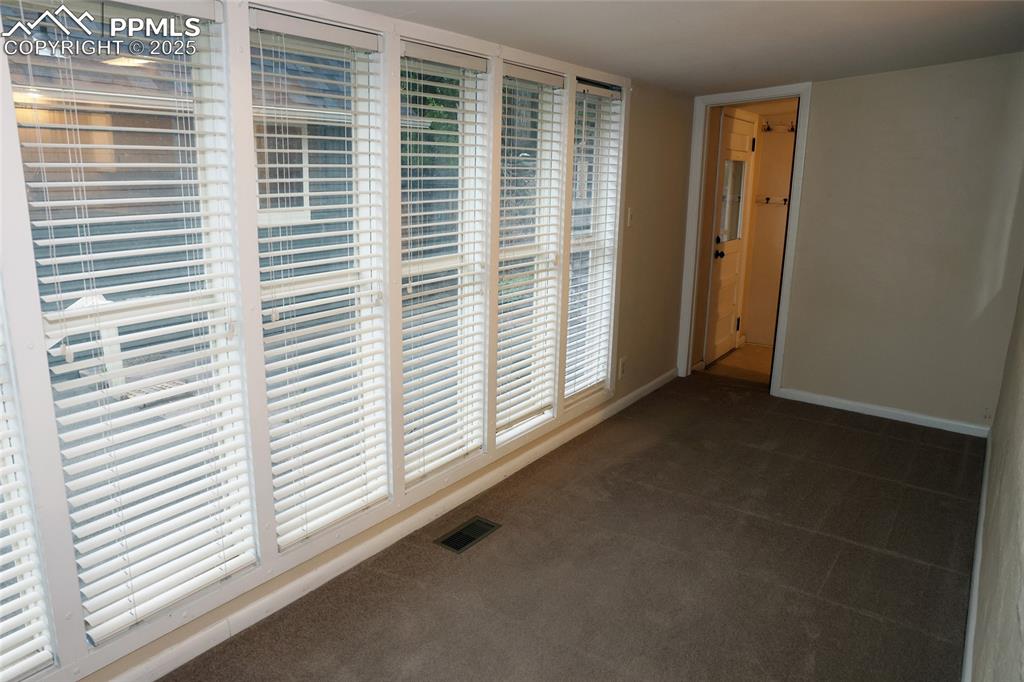 Image 10 of 16: Wall of Windows in the Bedroom