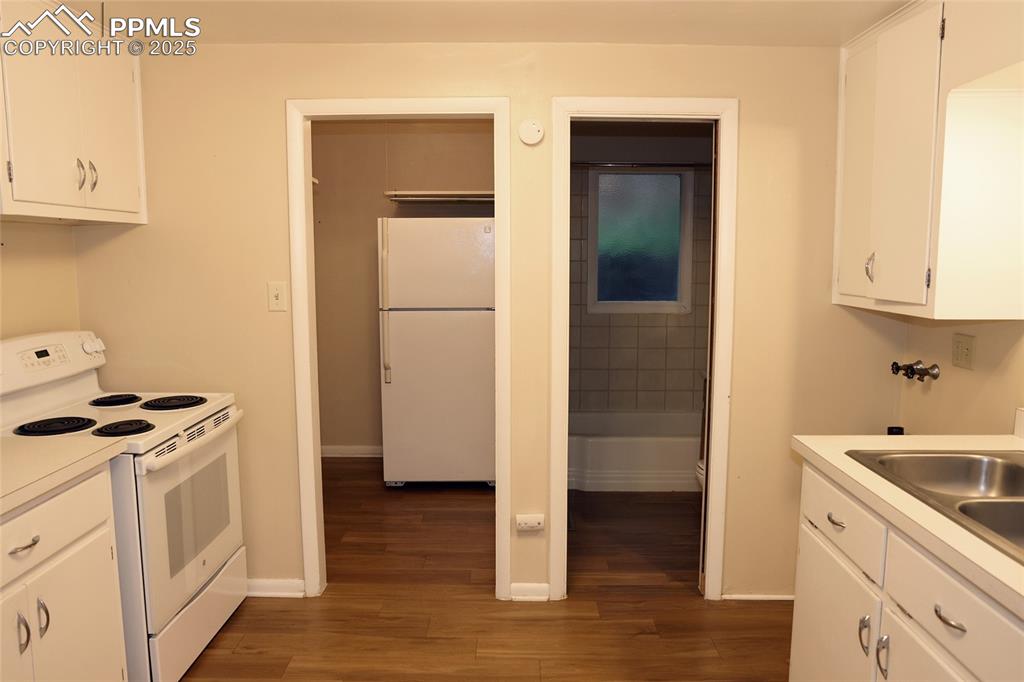 Image 6 of 16: Kitchen to Laundry and Bathroom View