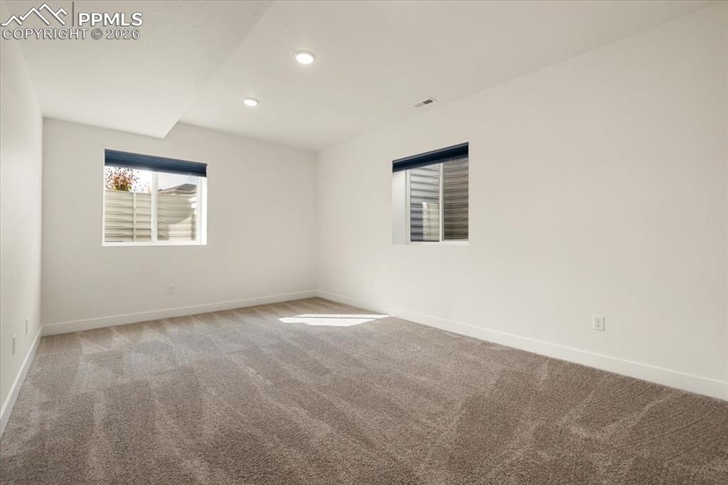 Image 22 of 29: Basement Bedroom